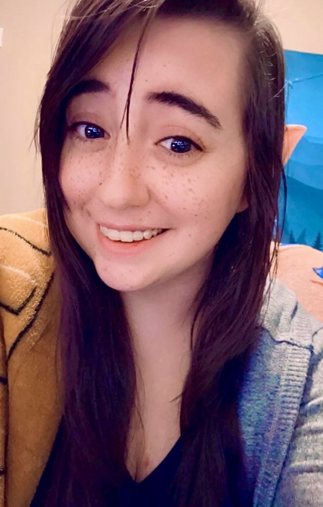 A selfie of nezz smiling with elf ears