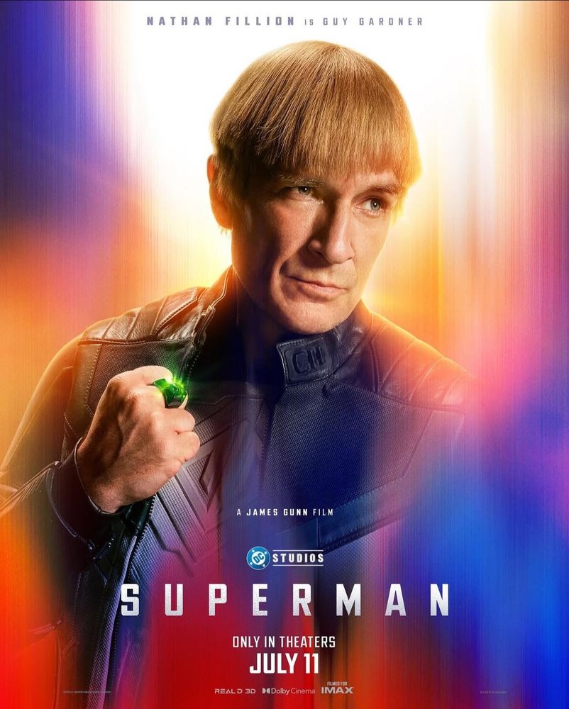 Nathan Fillion as Guy Garder with dry bowl haircut in Superman character poster.