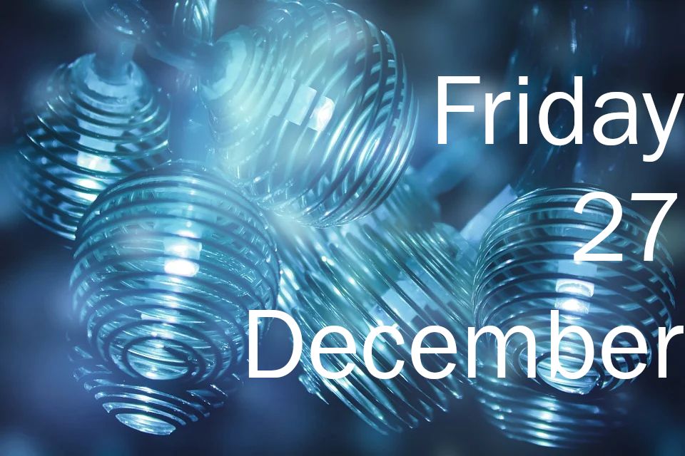 An abstract close-up of some blue baubles, gently glowing from inside.

Caption: Friday 27 December.