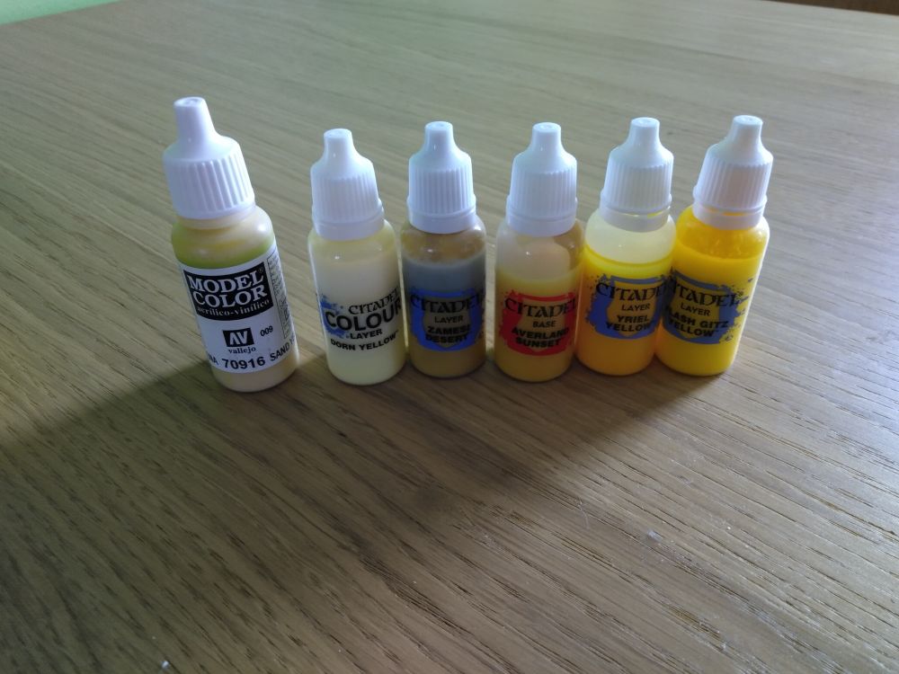 Vallejo Model Colour
Sand Yellow

Games-Workshop
 - Dorn Yellow
 - Flash Gitz Yellow
 - Yriel Yellow
 - Averland Sunset
 - Zamesi Desert