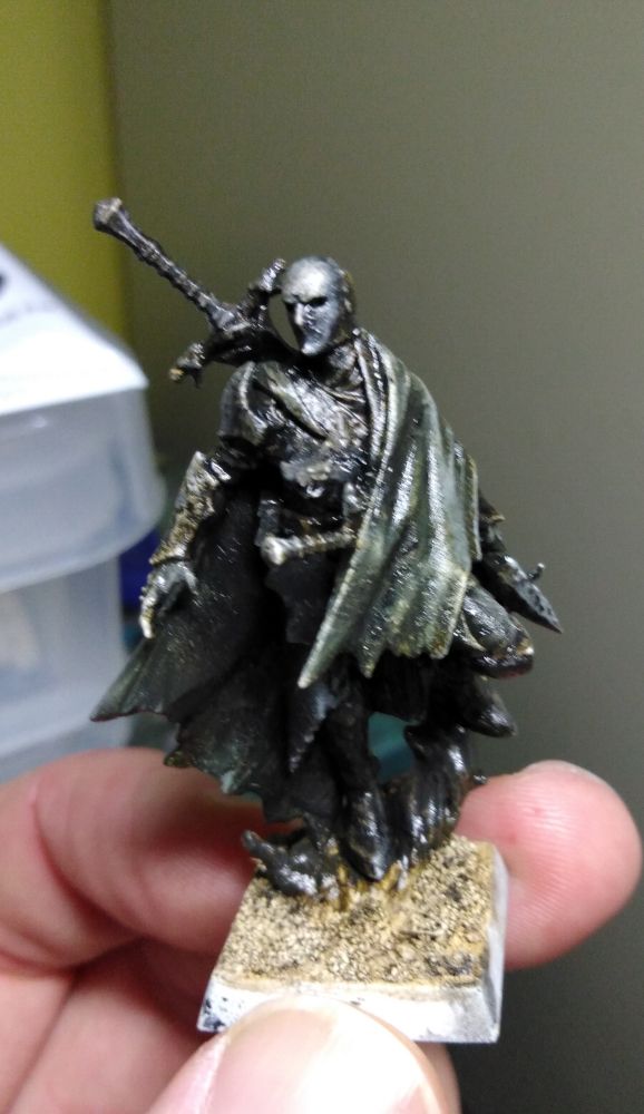 The Cado Ezechiar model from Games Workshop in a dark colour scheme, see from the front. The head has been swapped from a Stormcast Arcanist and the clock cut down at the front.

Gregor is the Old Count's second and much put upon child. He managed to recover his father's ashes and inter them in preparation for his resurrection. That would require his sister to get back and do her duty however, but since when did she ever listen to his advice or thank him for running interference for her. It would also help if the Old Count was resting easily, but no - his spirit clings distantly to the ancestral family blade just enough to offer regular commentary on the failings of his progeny. Gregor's hunting hounds and trained fell bats are essential for keeping on her trail when she tries to loose him, and intercepting unlucky patrols that cross their paths before too much of an army can be organised against them. 