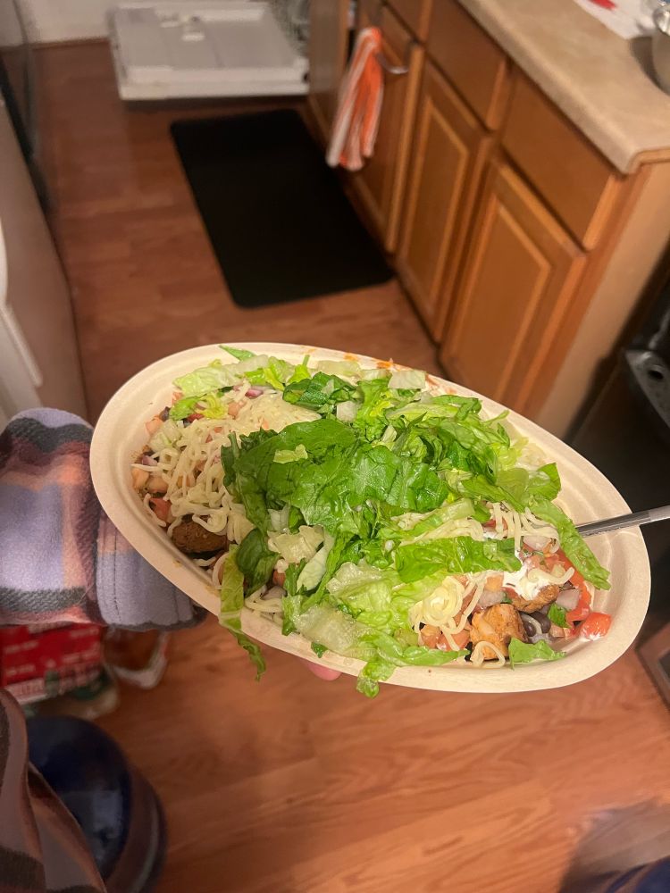 I’m holding a burrito bowl from chipotle