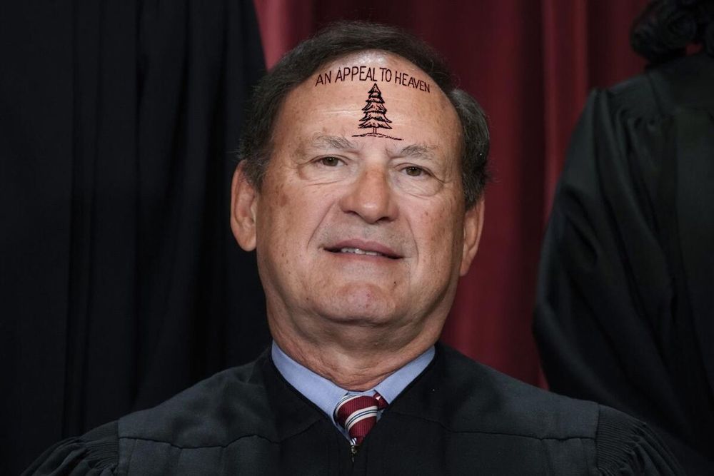Alito with the "An Appeal to Heaven Pine Tree" flag design on his forehead.
.