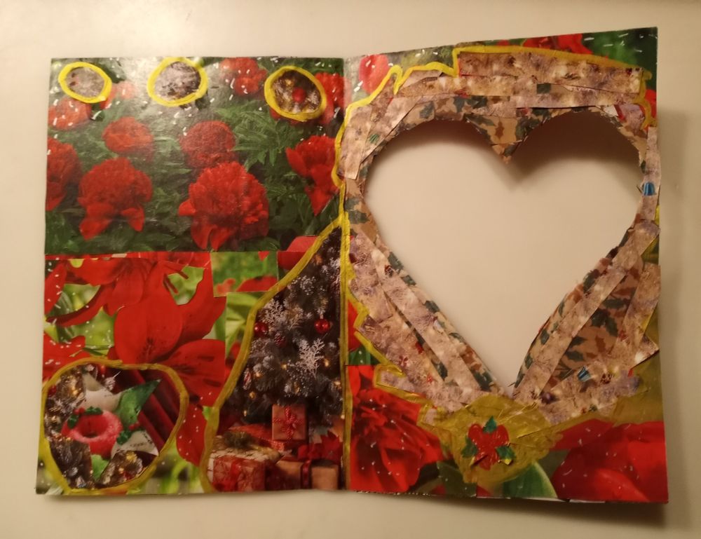 Inside of card: an abstract collage in red and green with gold outlines. There is a cutout outlined in white sparkles.