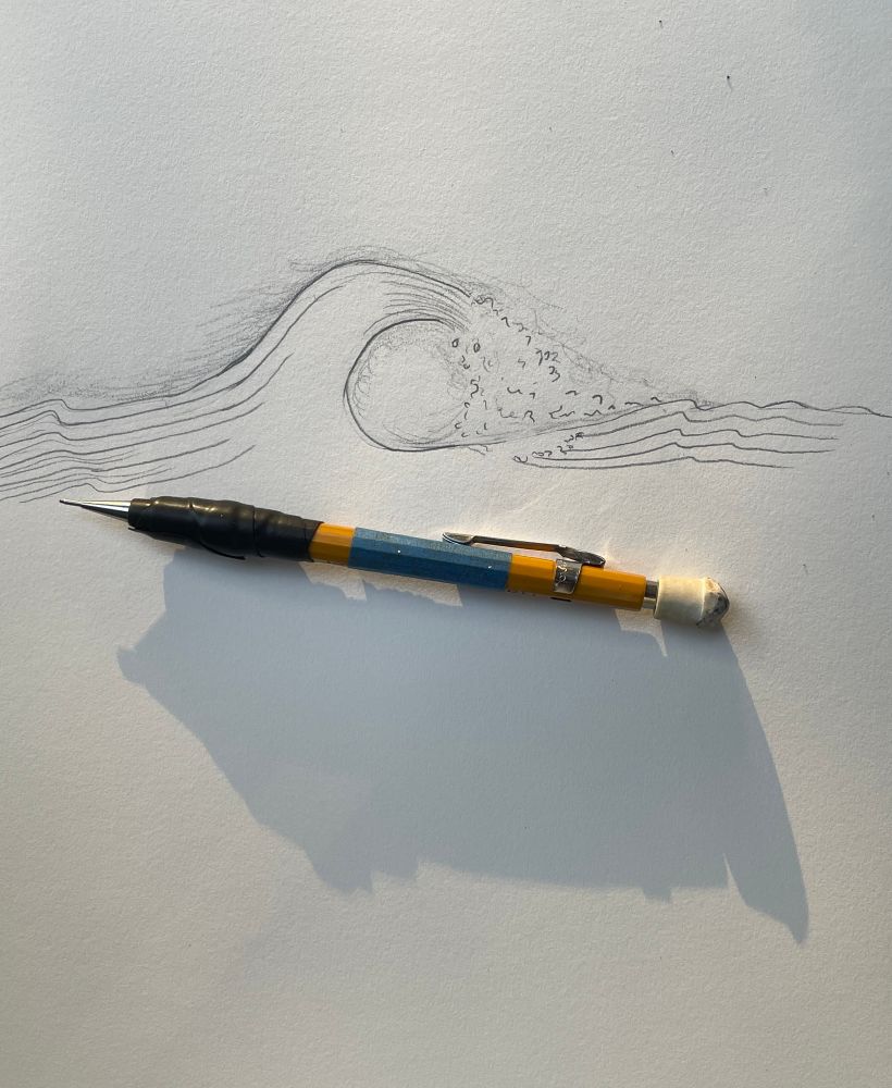 Sketch of a wave and the pentel pencil that drew it. The pencil casts a long shadow in the early morning light.