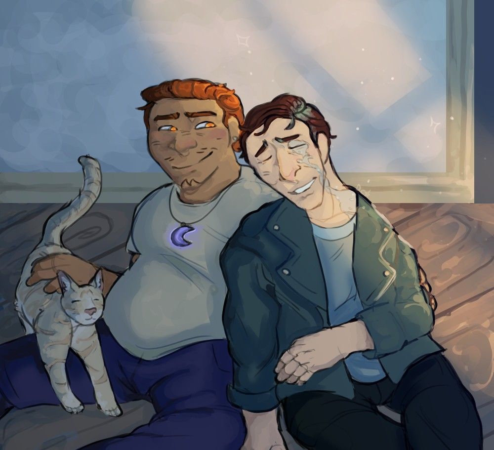 Two guys (Chester: left and Michael: right) sitting on a wooden floor while a tabby cat comes prancing over for attention.