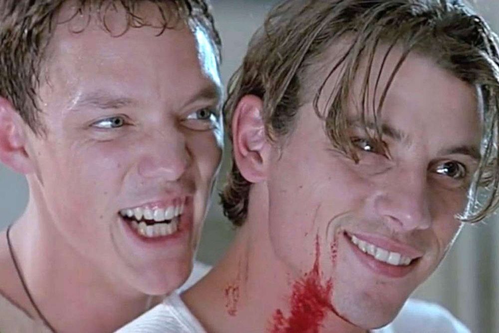 A bloody and maniacal Stu & Billy grinning in SCREAM