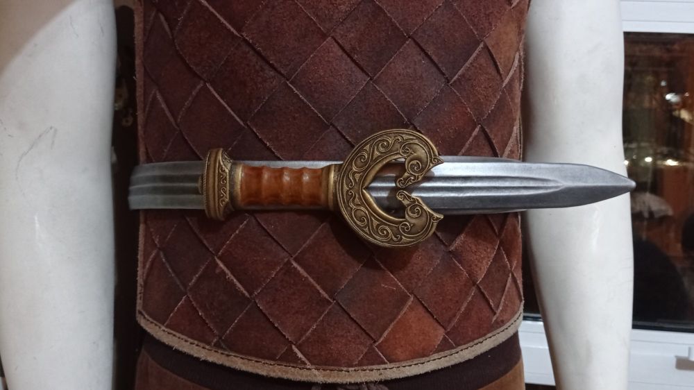 Pic of the darkest and longest Théoden swordbelt, displayed on a white mannequin wearing a viking style hardened suede cuirass