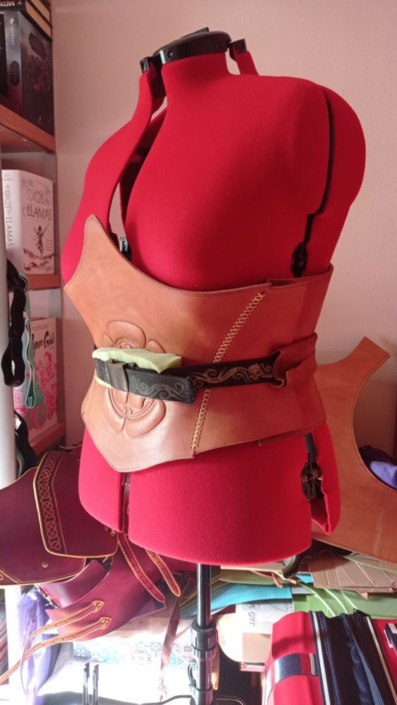 Front and back parts of the corset, put on the dressmaking mannequin and wrapped with a belt to keep them together