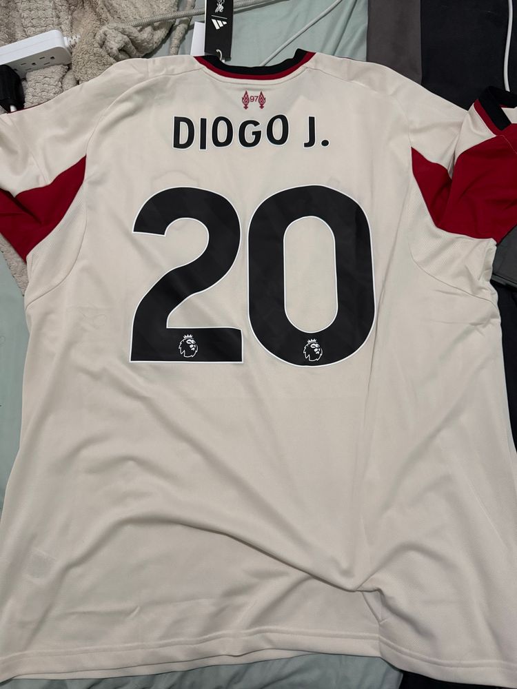 Back of a Liverpool FC 25-26 Away kit. Nameplate “DIOGO J.” Number 20.