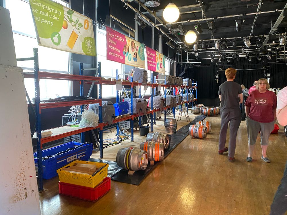 Beer kegs in theatre being put onto racks