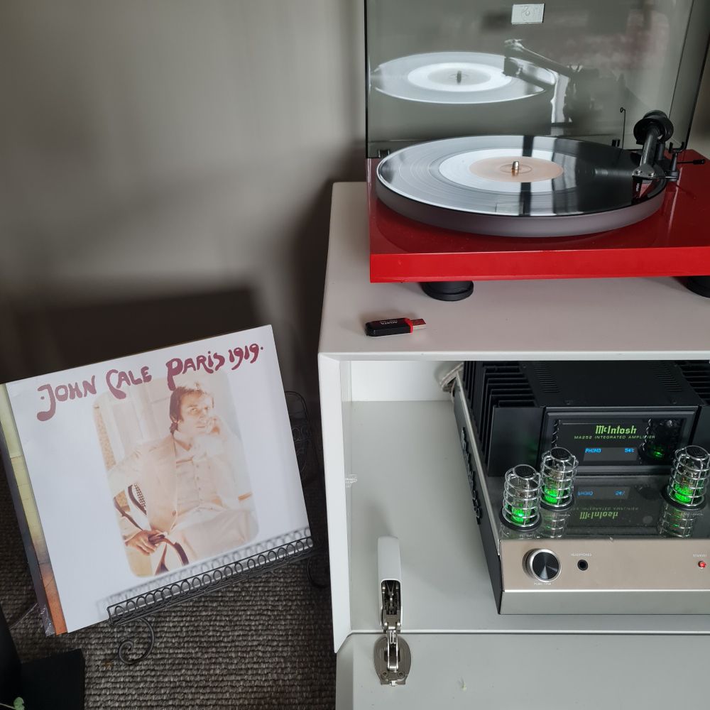 A record album, John Cale's 1919, on a turntable.  