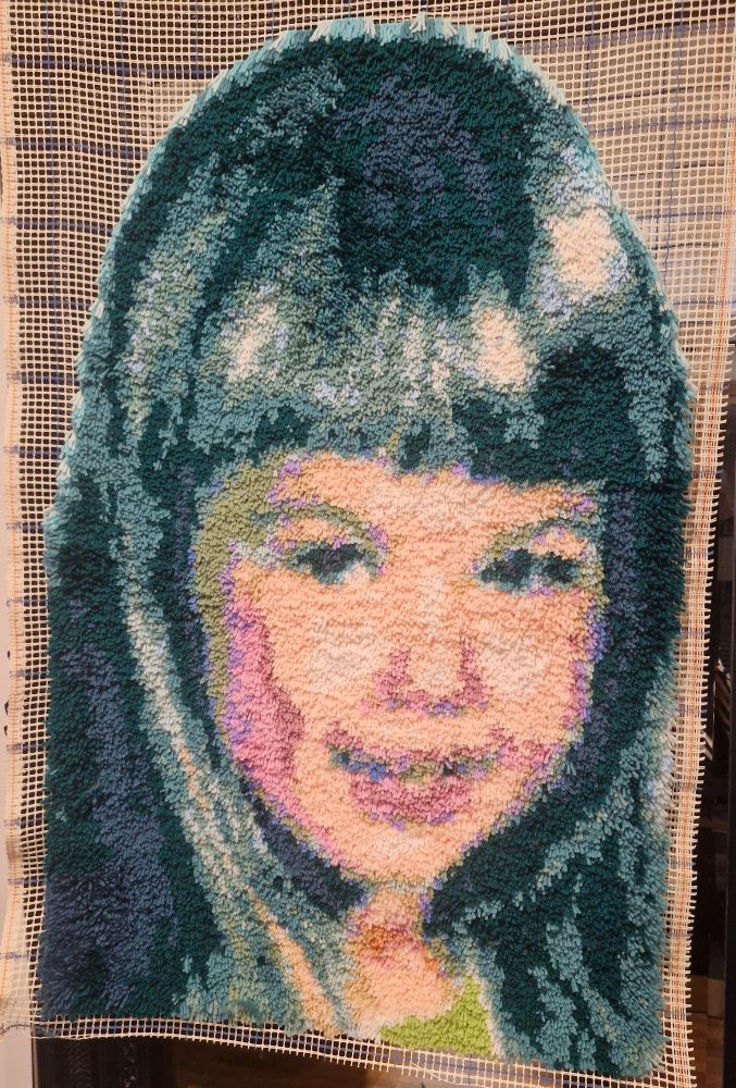 Hanging hook- latch artwork of a young girls face.