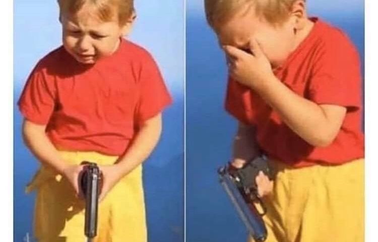 A kid in a red shirt holding a gun and crying like they just fuckin killed someone