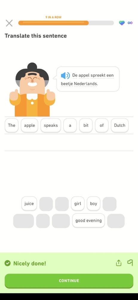 Picture from DuoLingo showing a woman saying 'The apple speaks a bit of Dutch'