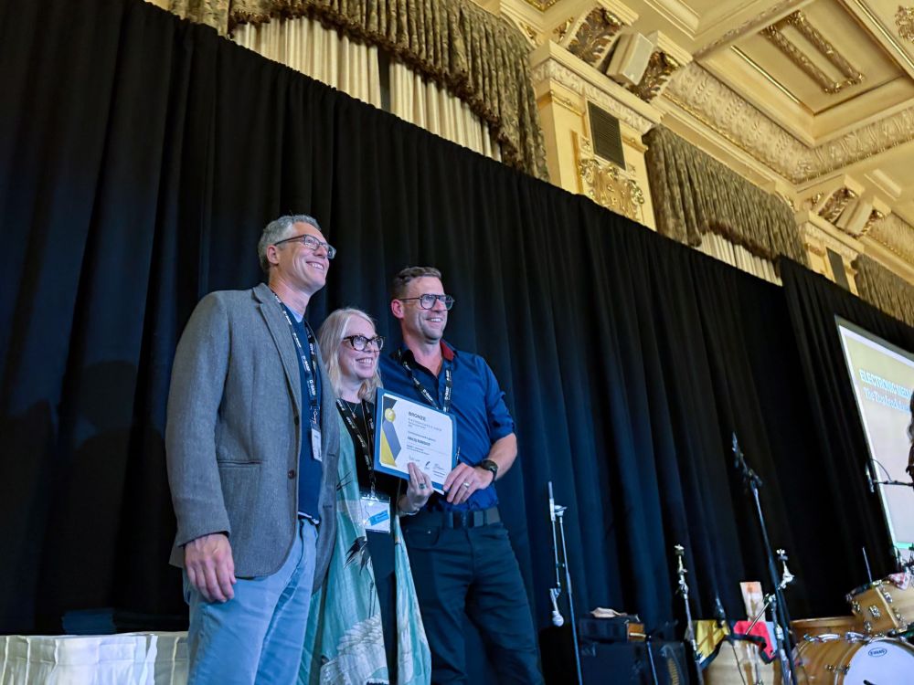 Jay Whetter and Toban Dyck accept an award at the CFWF conference