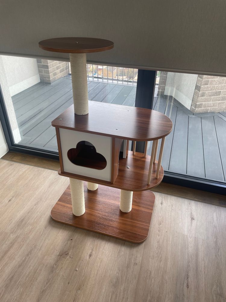 A three tiered car tree with wooden levels, 4 scratching posts and a cloud shaped cubby hole