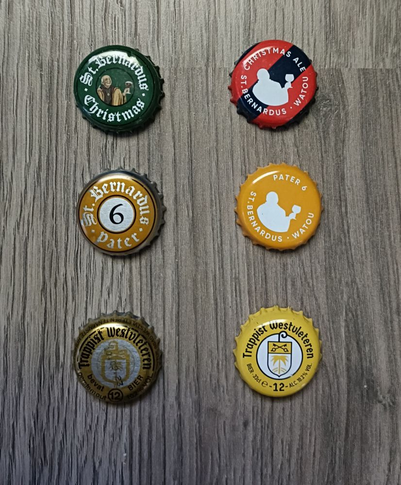 The picture shows 6 bottle caps of Belgium Abbey/Trappist beer. On the left the old design and on the right the newer design.