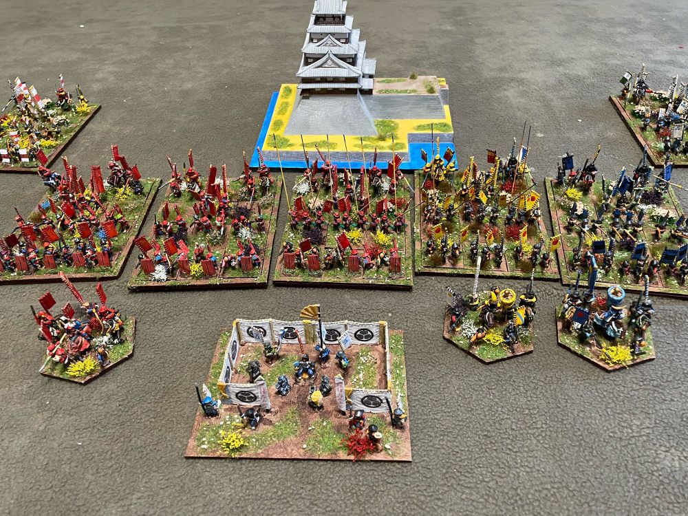 Samurai figures in front of castle