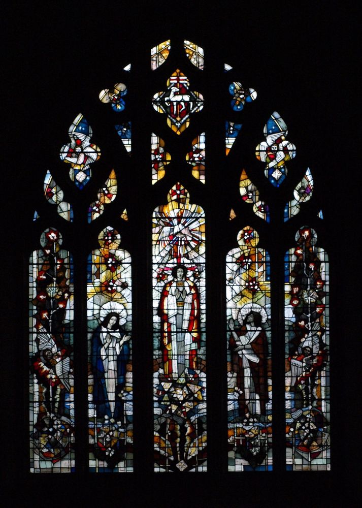 Large stained glass window with five main lights and tracery