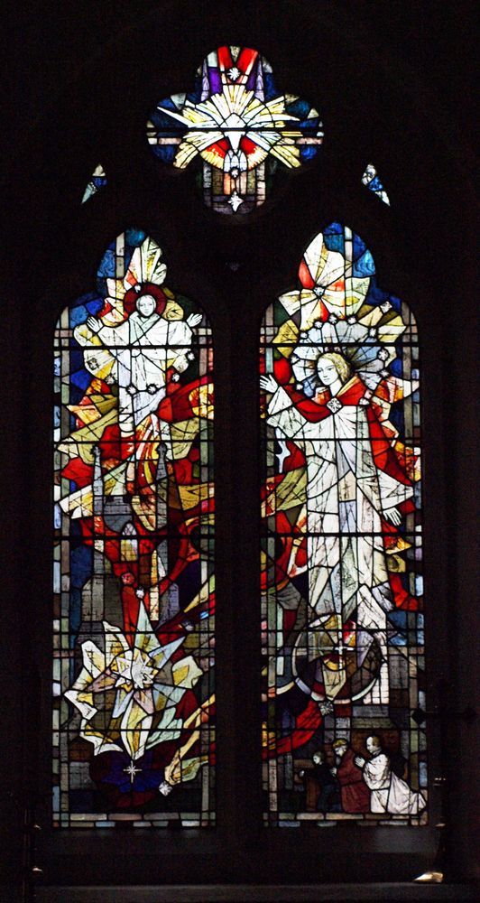 Two-light stained glass window with upper tracery lights.