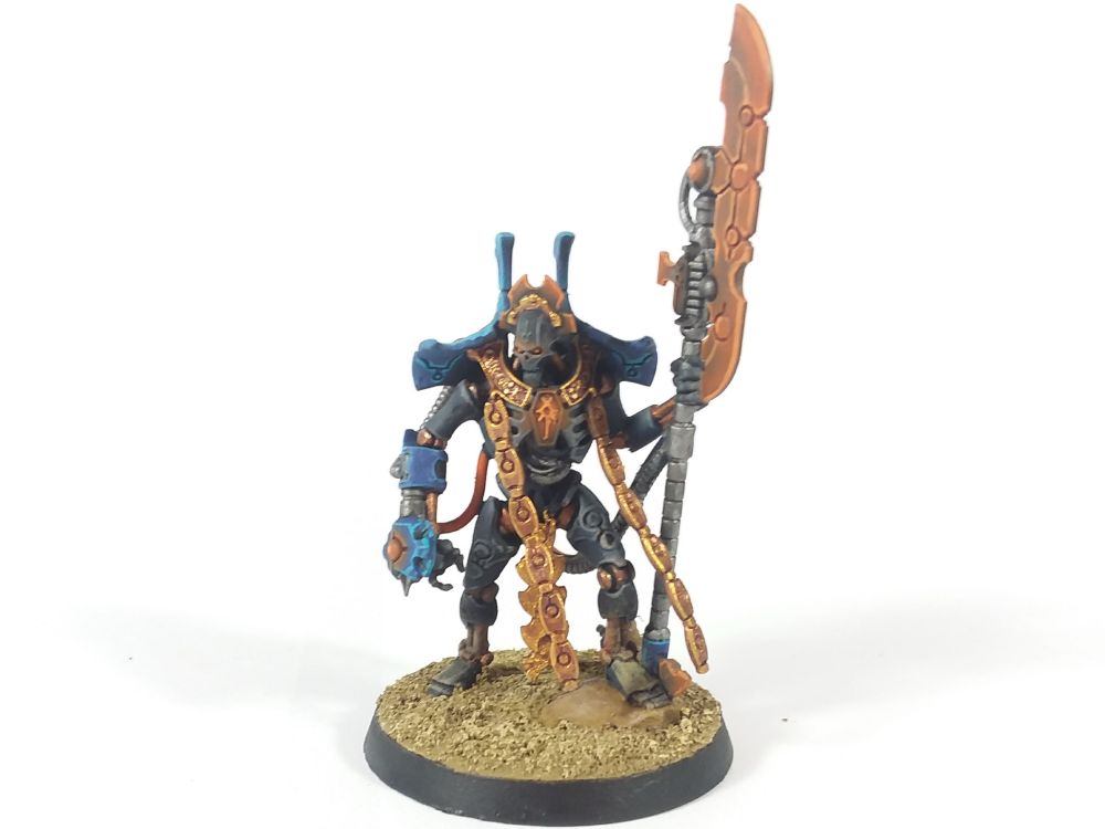 Overlord. The majority of the body is black, with the endoskeleton featuring brass coloring. The shoulder panels and tachyon arrow housing are blue, and all powered bits are orange. Gold is used on the me decorative elements.