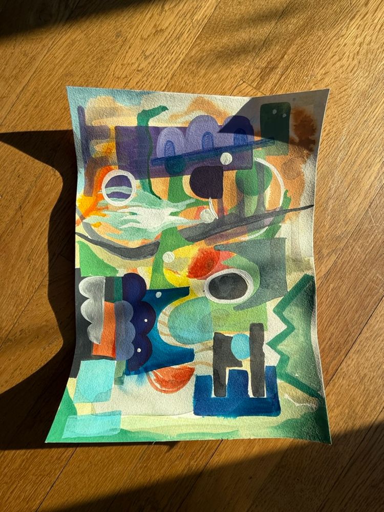 Four abstract artworks set on top of a warm wooden floor in the afternoon sun.