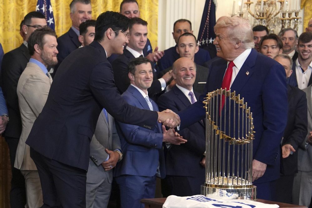 Image of Shohei Otani, who is 6’3” and weighs 210lbs, bowing slightly and shaking Donald Trump’s hand. Donald Trump claims to be 6’3” and weigh 225lbs, but he is just barely at Otani’s height when in a bow and is notably huskier. 