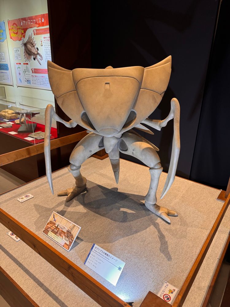 A replica fossil of the Pokémon Kabutops, posed similarly to its Gen 1 sprite.