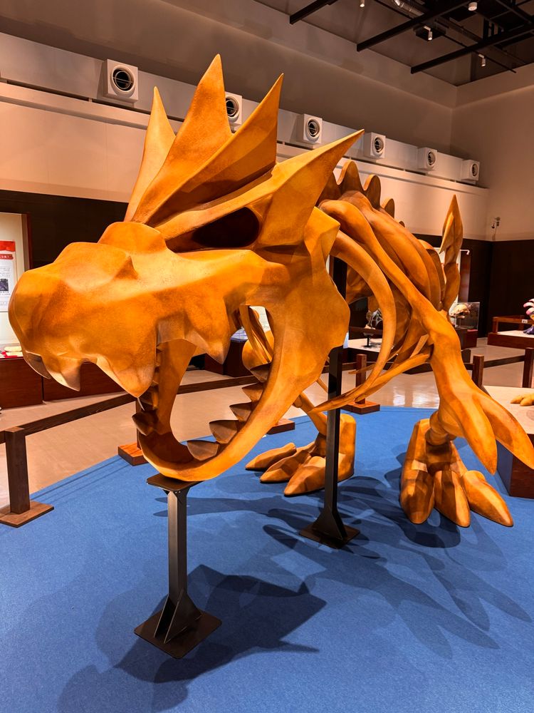 Replica fossil of the Pokémon Tyrantrum, with its mouth open.