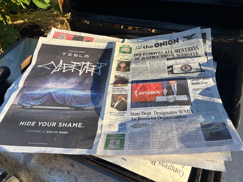 Paella covered by a print copy of The Onion newspaper