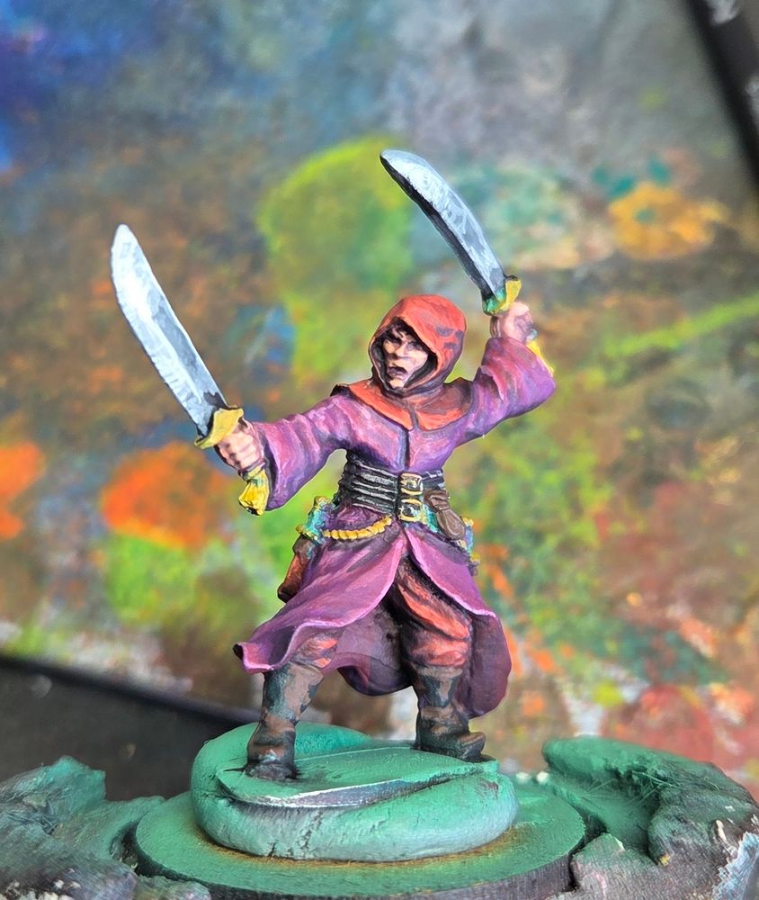 A purple and red cloaked miniature from athena miniatures