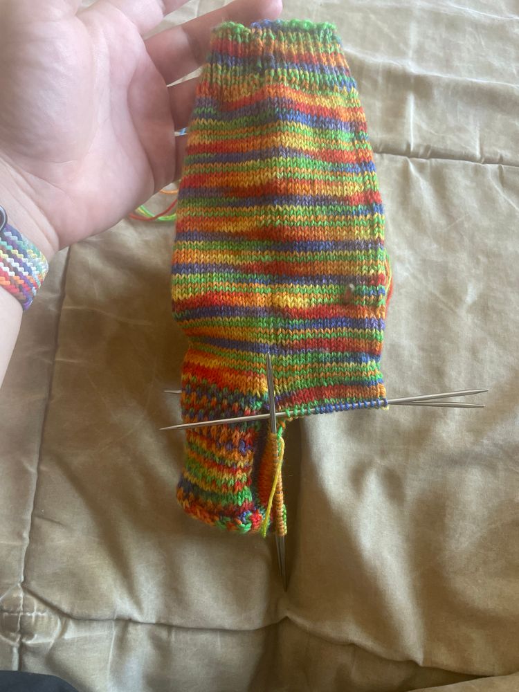 Rainbow socks on needles 