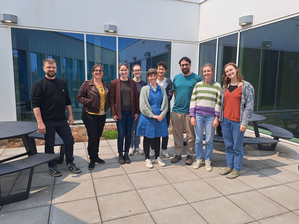 Researchers from the Marine Mammal Research division at Aarhus University and the European Tracking Network group at the Flanders Marine Institute met in Begium at VLIZ to discussion our big data goals. Image is of 9 researchers standing outside in the wind in front of a building. 