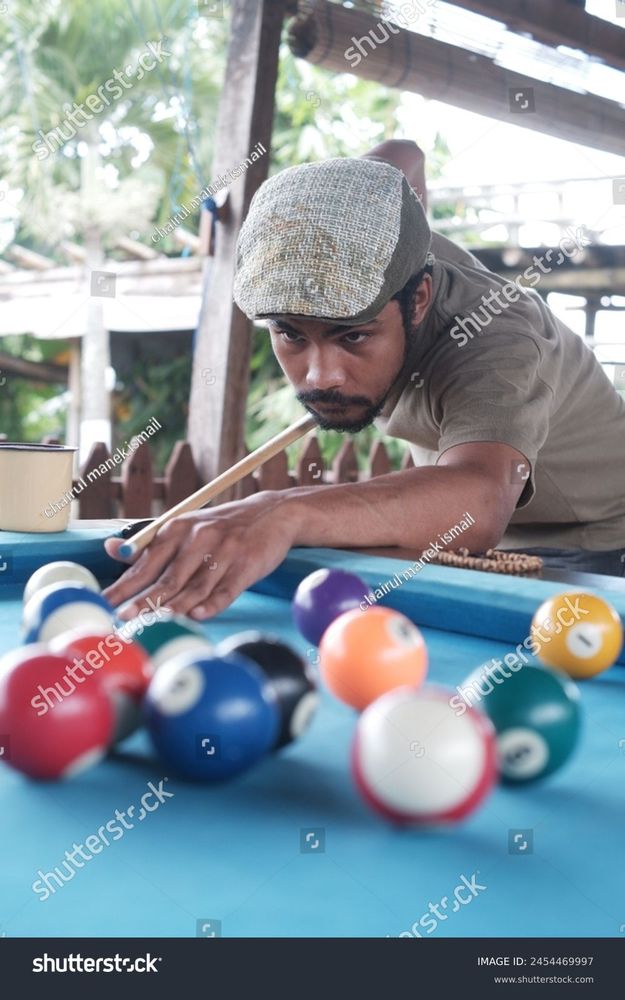 Guy playing pool