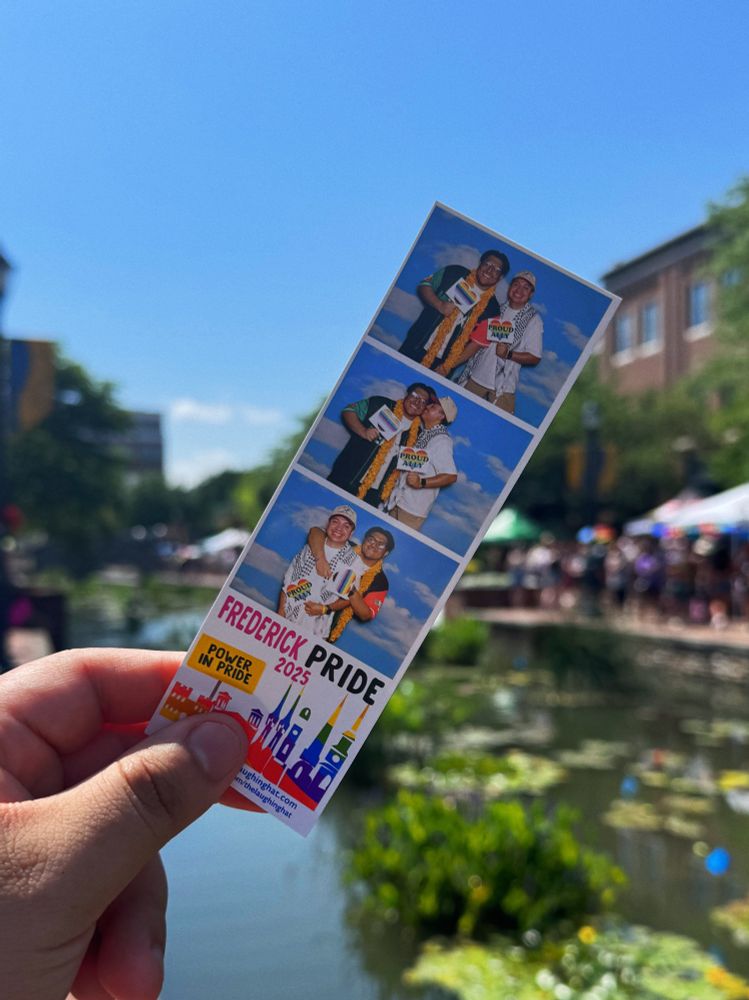A picture of a photo strip of Ed and his bf in front of a creek during a Pride festival.