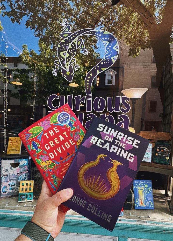 Photo of The Great Divide and Sunrise on the Reaping in front of my local bookstore.