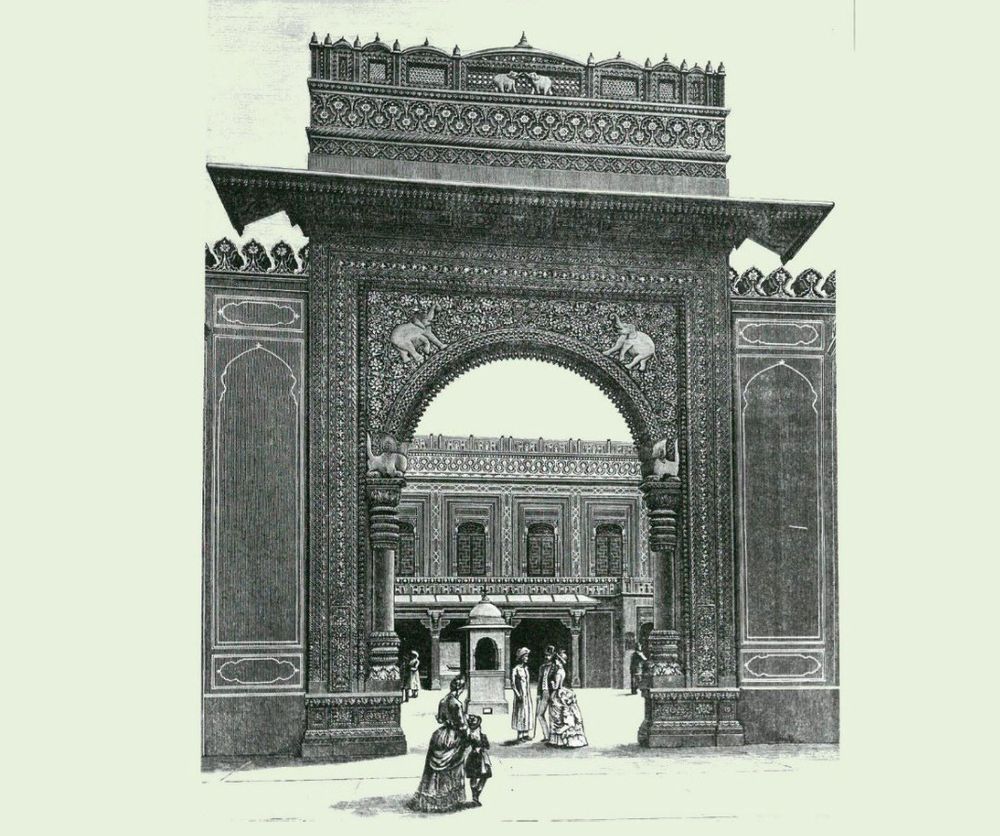 The Gwalior Gate, the Colonial and Indian Exhibition, 1886, RIBA Collections. SOURCE: Builder, vol. LI (1886 July 3), 16. An image in B&W of ornate Indian gate with women in Victorian dresses and a child wandering through. 