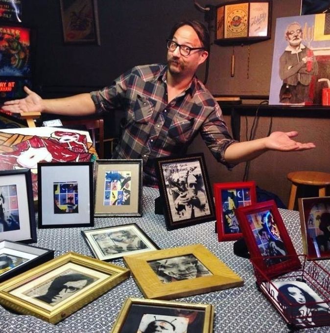 me, "oxtails", "murray maids dust-busting", and my merch at the punk rock art market at the lost well in austin, texas 2015. its always fun looking back at old photos and the problematic prints i no longer sell, like the numerous wody allen and bill cosby prints. it was wrong in 2015 and i totally knew better but they also sold the best. that being said if i was lucky i sold enough of these framed prints to cover my venting fees and bar tab. that would make riding the bus or talking an unsuspecting friend into giving me and my stuff a ride home easier. i am still lugging those paintings around. i have prints of murray-maids.