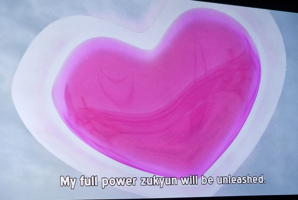 A big purpley-pink heart floating in the sky.