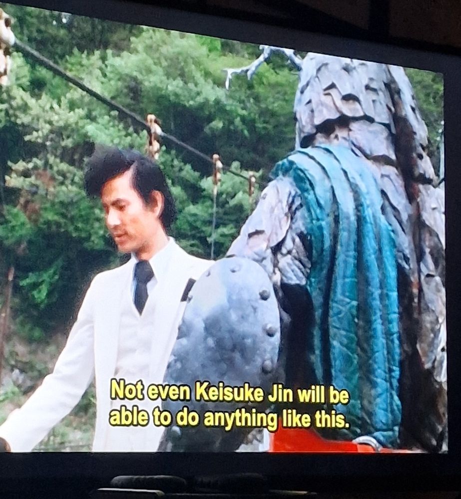 Apollo Geist in an all white suit in the woods.