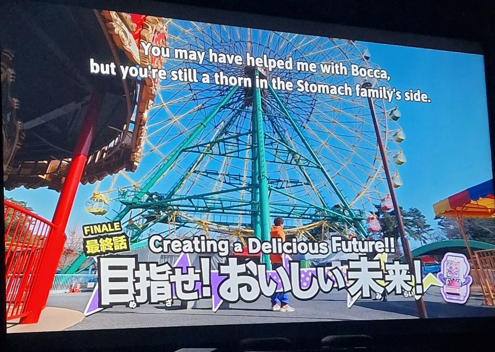 Shoma confronts Lango in an abandoned funfair as the episode title 