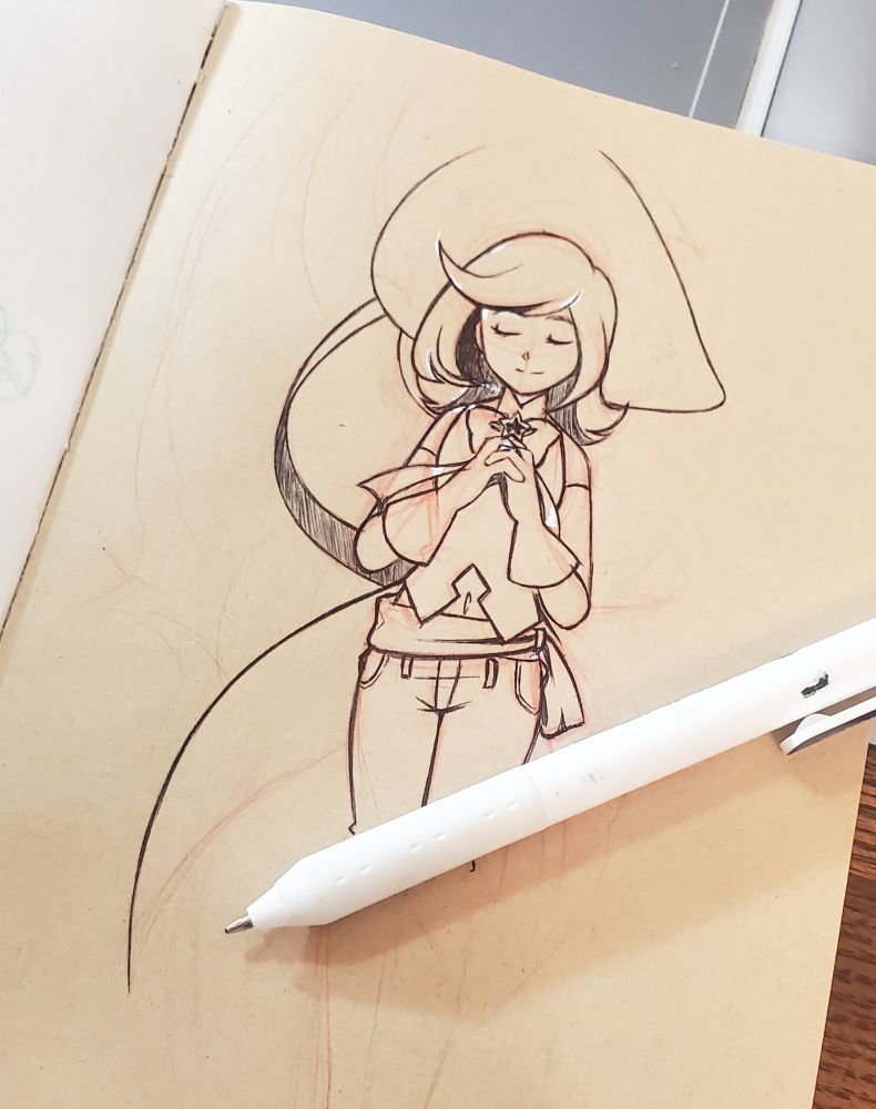 a half finished drawing of a Witch clasping her hands together with her hands clothes with a ballpoint pen on top.