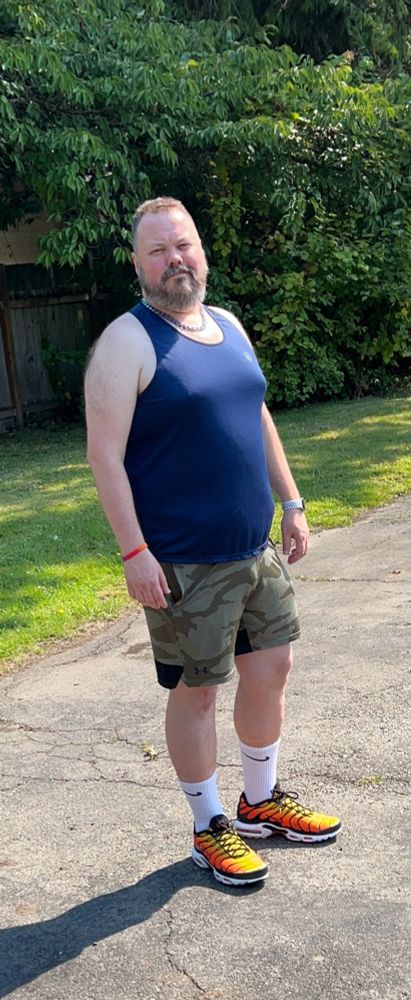 Man in shorts and tanktop