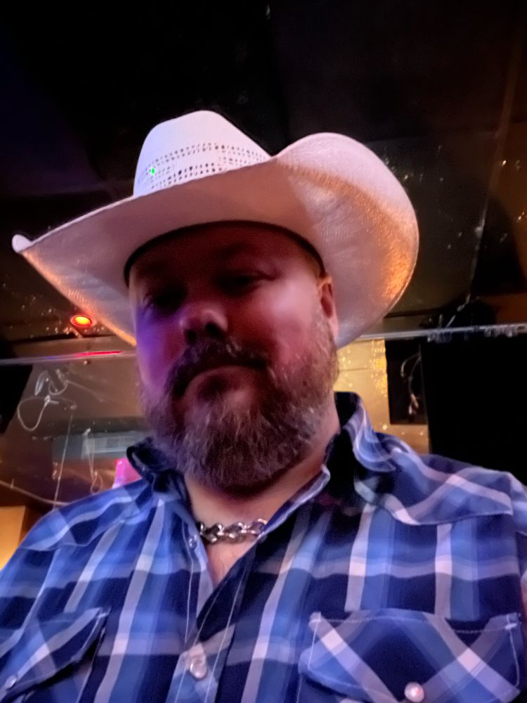 Man in straw cowboy hat