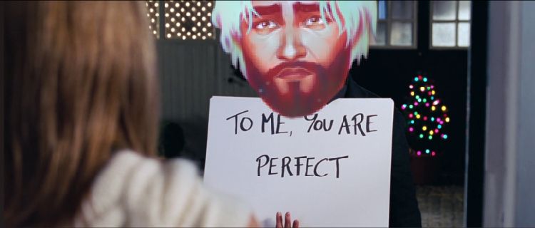 Jayce at Viktor’s door holding a sign that reads TO ME, YOU ARE PERFECT