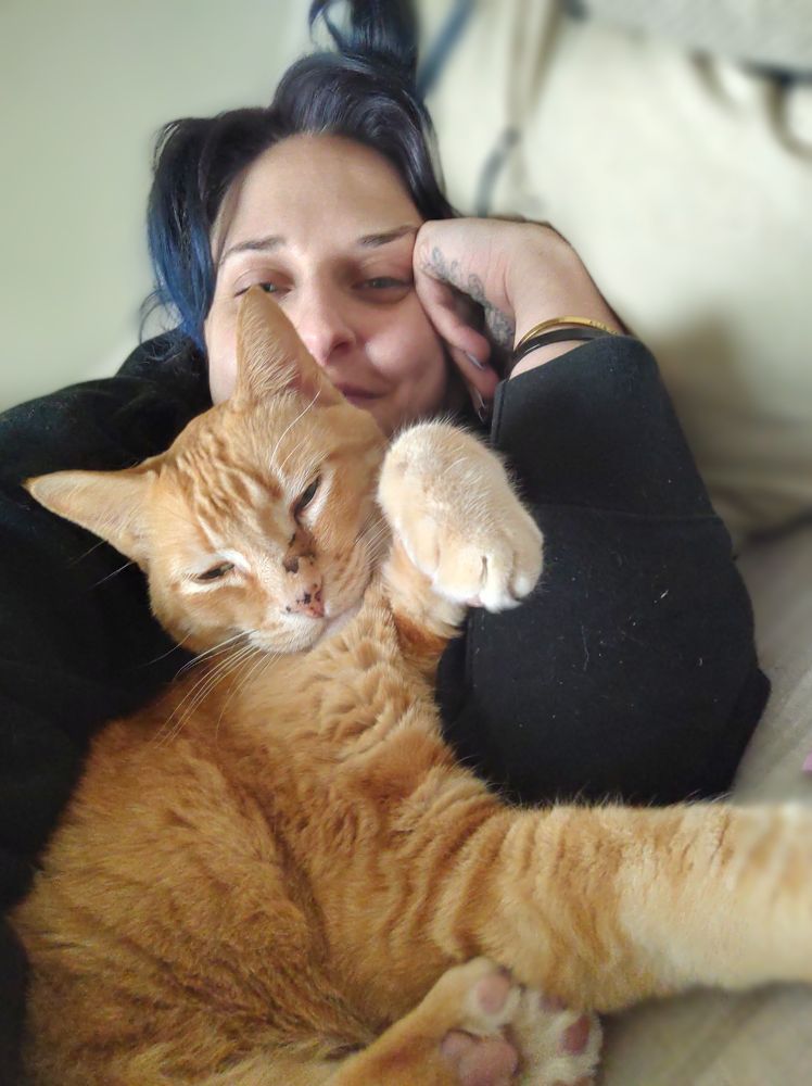 my orange cat and me having a snug