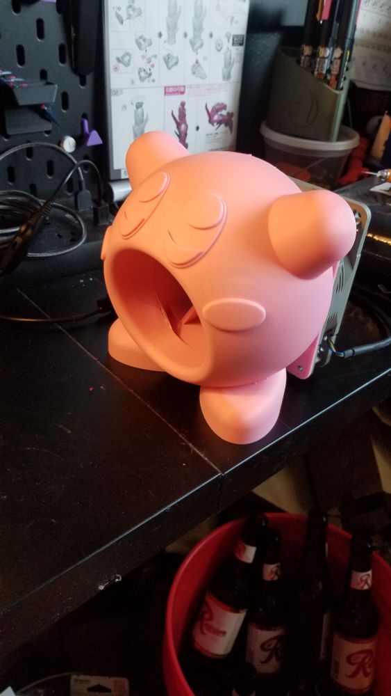 Kirby with a fan in the back so he's sucking away