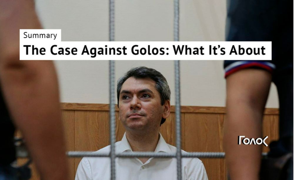 During the trial, Grigory Melkonyants, co-chair of Russia's leading election watchdog Golos, is held in a cage inside the courtroom.