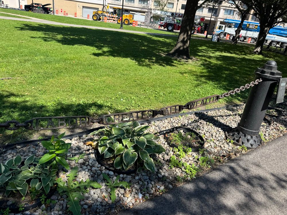 “Labor creates all wealth,” reads a chain at Frank Zeidler Union Square in Milwaukee.